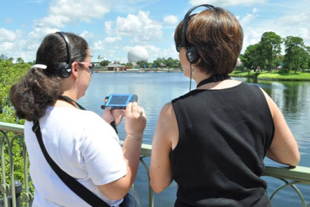 Mother and son Guests exploring the outdoors with handheld device
